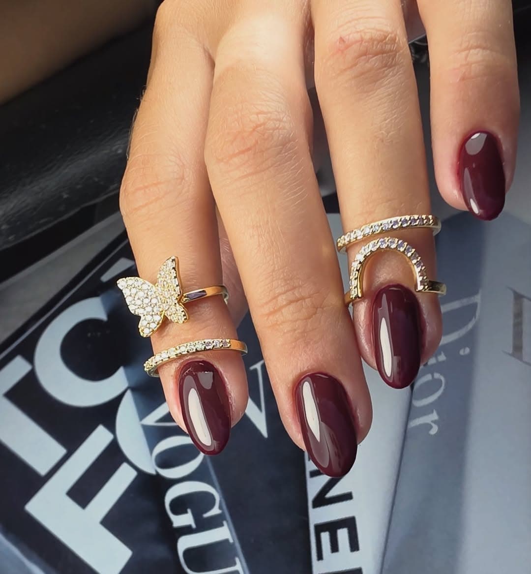 Red nails on a magazine